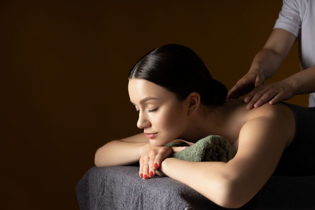 Woman receiving a relaxing shoulder massage in Botany Auckland
